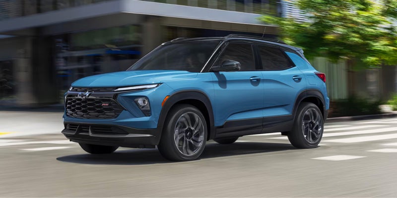 Blue Chevrolet Trailblazer driving on a city street with modern design
