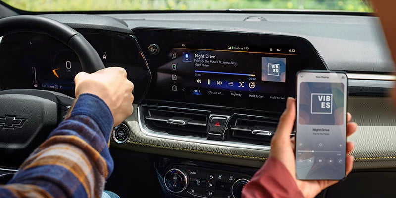 Chevrolet interior with dashboard display and smartphone connected for infotainment