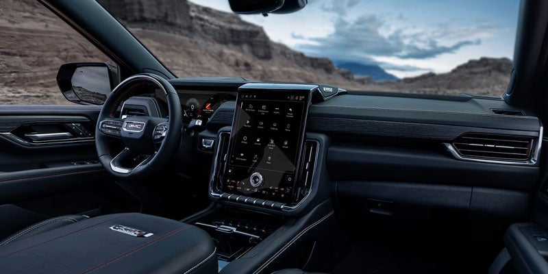 GMC Yukon interior with large touchscreen and modern dashboard design