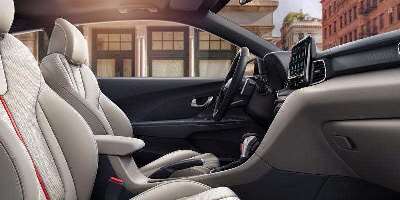 Hyundai Veloster interior with front seats, dashboard, and center console