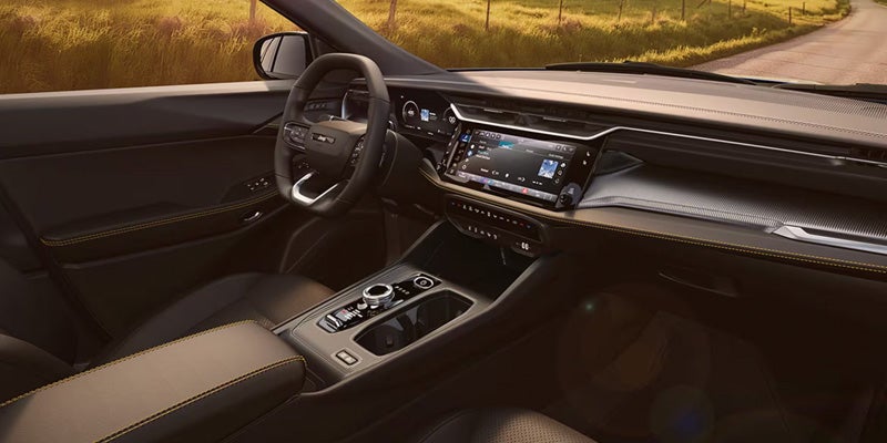 Jeep Cherokee interior with dashboard layout, touchscreen display, and center console controls