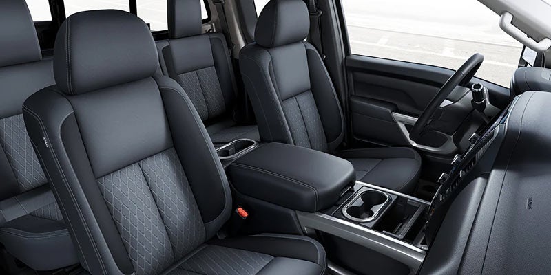 Nissan Titan interior with leather seats, center console, and spacious cabin design